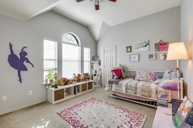 a bedroom with furniture and a window