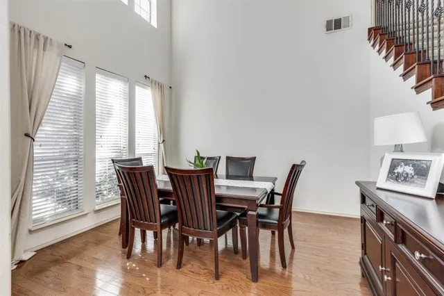 a view of a dining room with furniture and a large window
