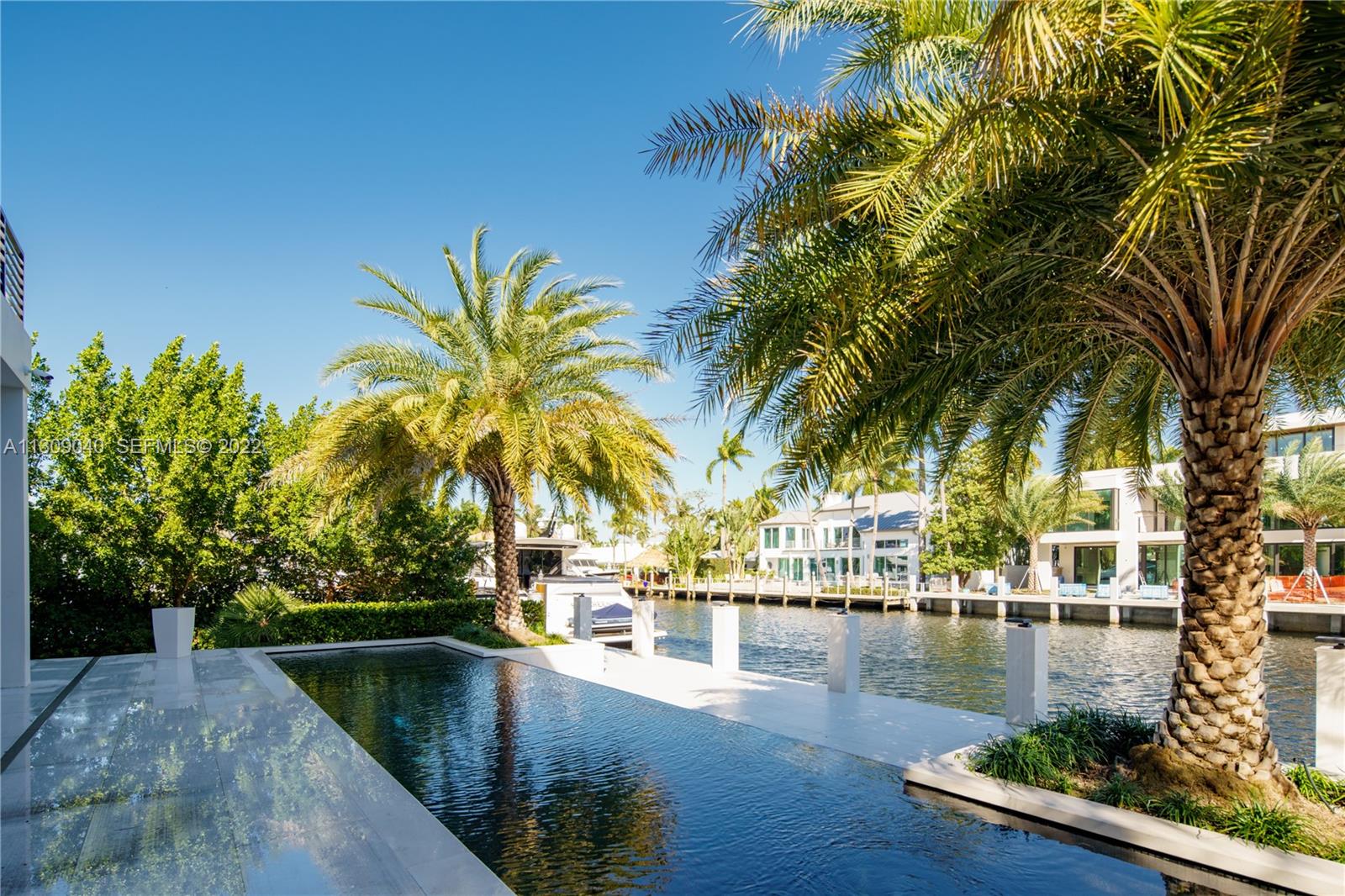 128 Fiesta Way Fort Lauderdale, FL 33301 - Photo 16 of 60 a view of swimming pool with a table and chairs
