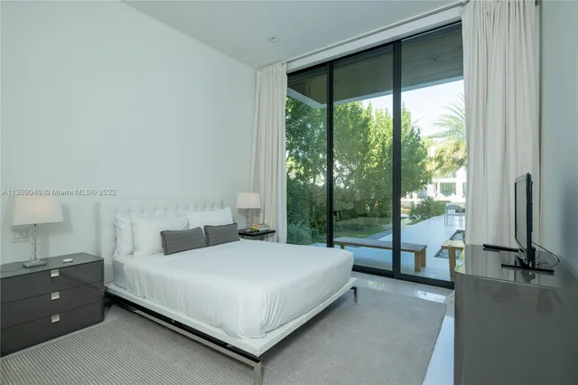 a white toilet next to a bathroom sink