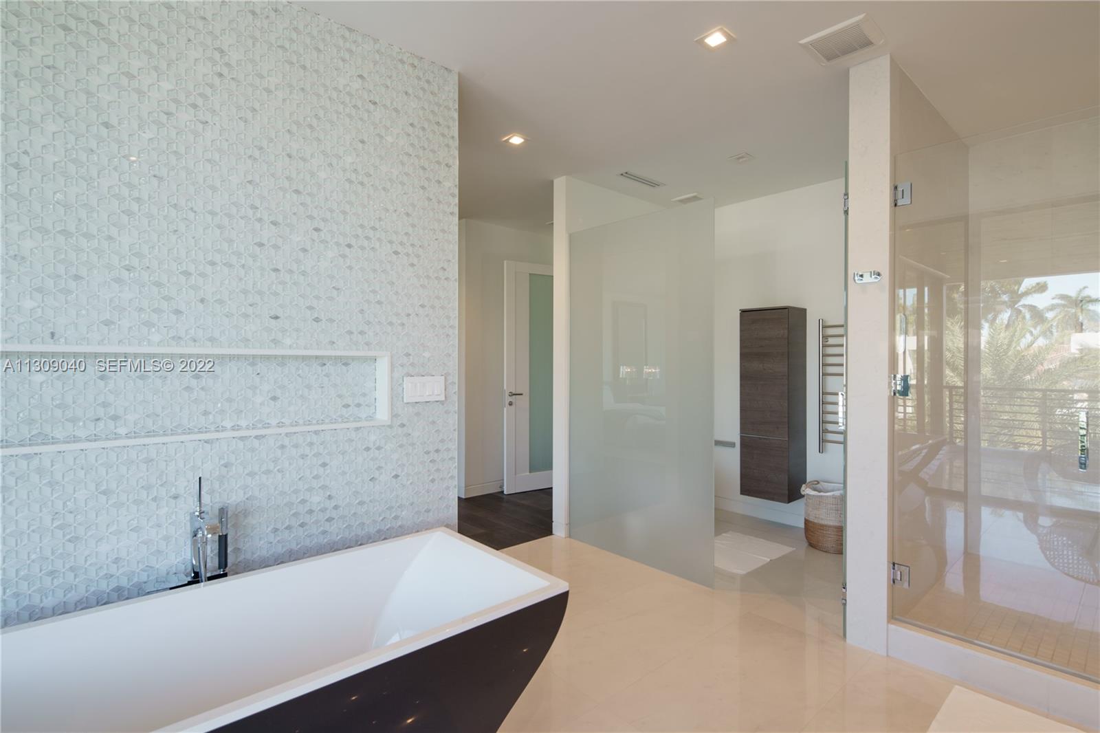 128 Fiesta Way Fort Lauderdale, FL 33301 - Photo 33 of 60 a bathroom with a bathtub and a shower