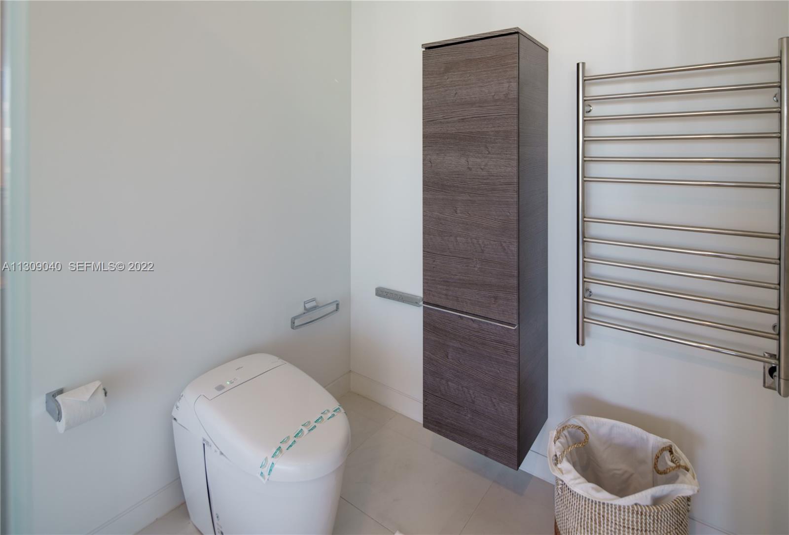 128 Fiesta Way Fort Lauderdale, FL 33301 - Photo 34 of 60 a bathroom with a toilet and a sink