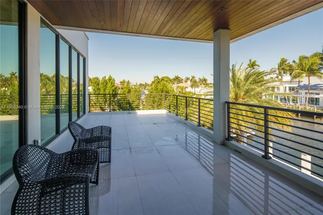 a room with a chair and painted walls