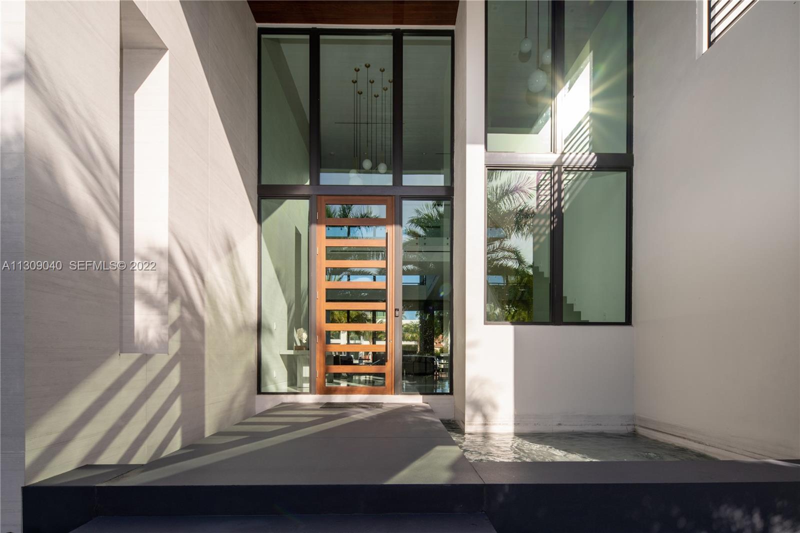 128 Fiesta Way Fort Lauderdale, FL 33301 - Photo 5 of 60 a view of a door with a window