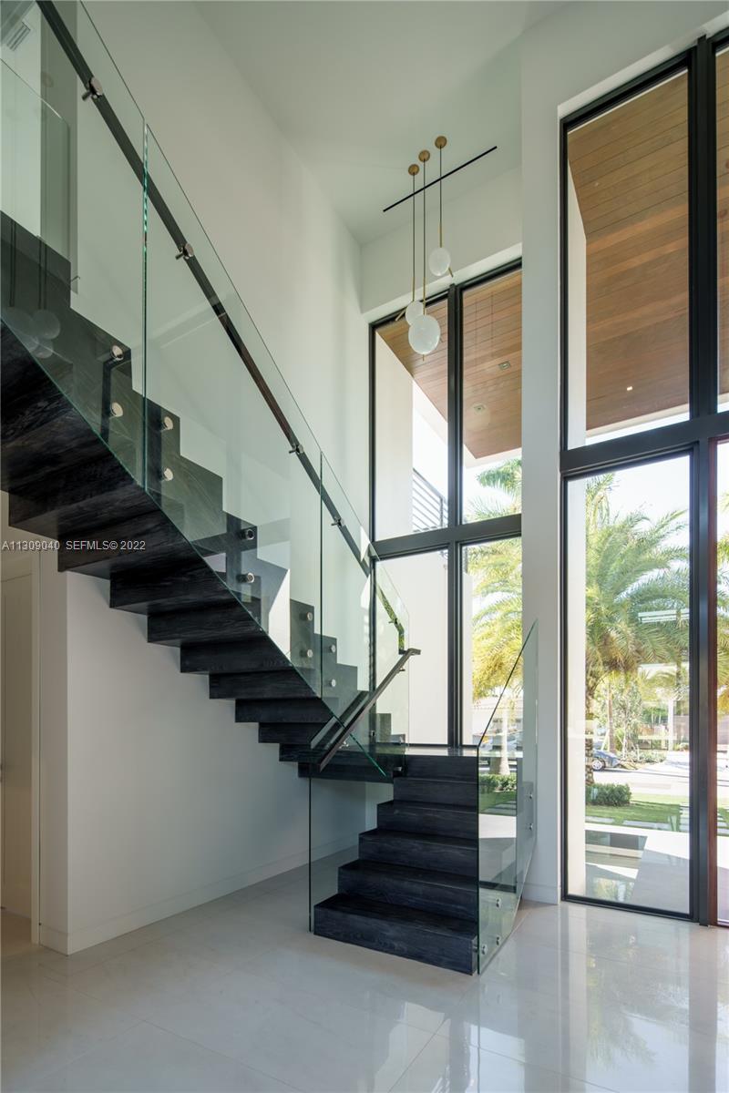 128 Fiesta Way Fort Lauderdale, FL 33301 - Photo 7 of 60 a view of entryway and hall with stairs