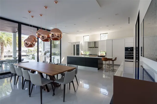 a view of a dining room with furniture and a large window