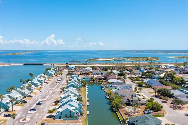 an aerial view of a house with a ocean view