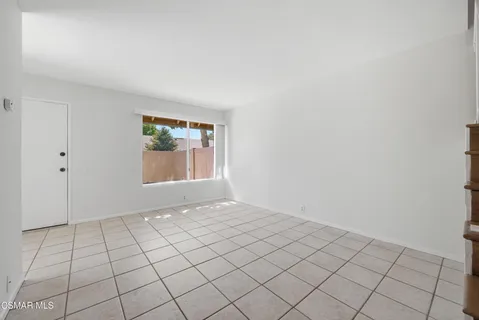 a view of an empty room and window