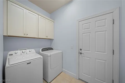 a view of storage and utility room with washer and dryer