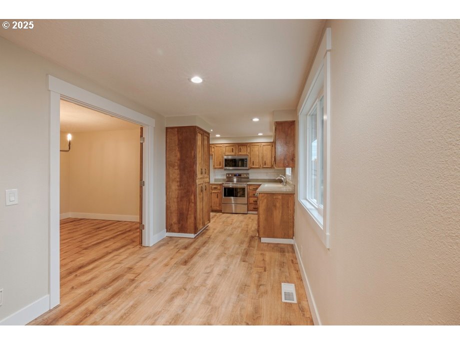 1735 Misty Place Northwest Salem, OR 97304 - Photo 12 of 31 a view of a kitchen with wooden floor