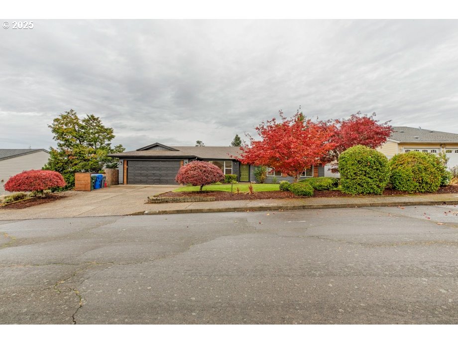 1735 Misty Place Northwest Salem, OR 97304 - Photo 30 of 31 a front view of a house with a yard and garage