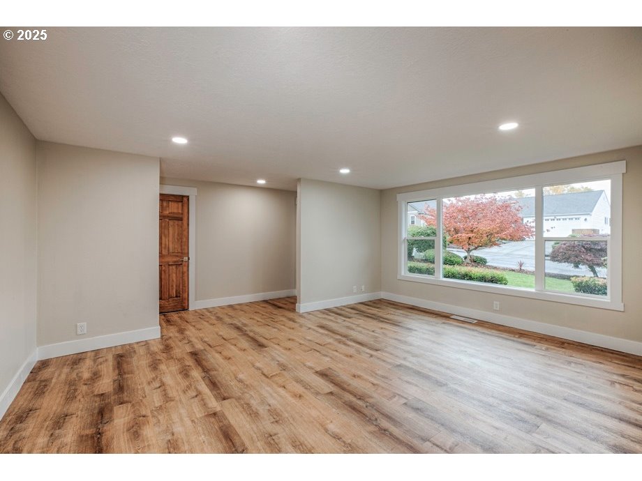 1735 Misty Place Northwest Salem, OR 97304 - Photo 4 of 31 a view of an empty room with wooden floor and windows
