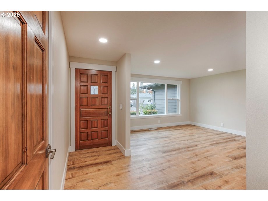 1735 Misty Place Northwest Salem, OR 97304 - Photo 5 of 31 a view of an empty room with wooden floor and a window