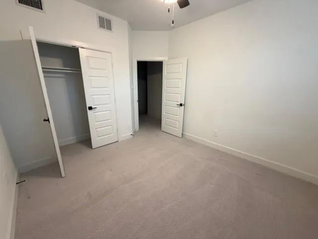 an empty room with closet and view