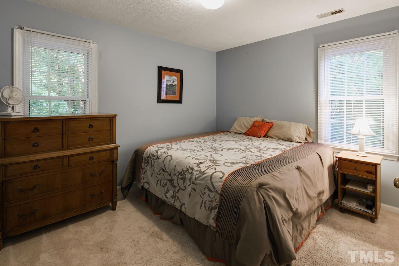 4 Cedar Hill Drive Durham, NC 27713 - Photo 14 of 49 a bedroom with a bed and a window