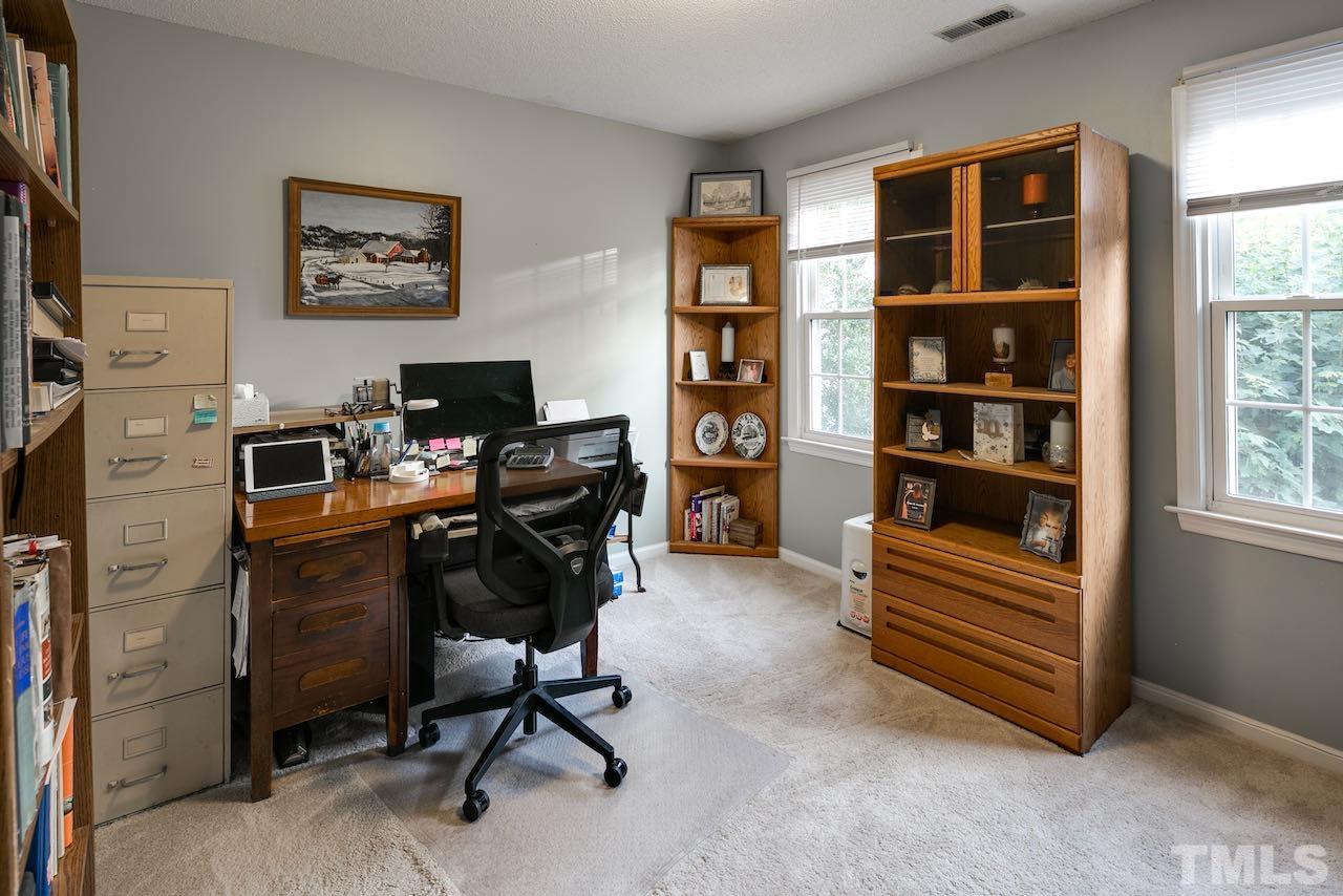 4 Cedar Hill Drive Durham, NC 27713 - Photo 15 of 49 a view of a workspace with furniture and a window