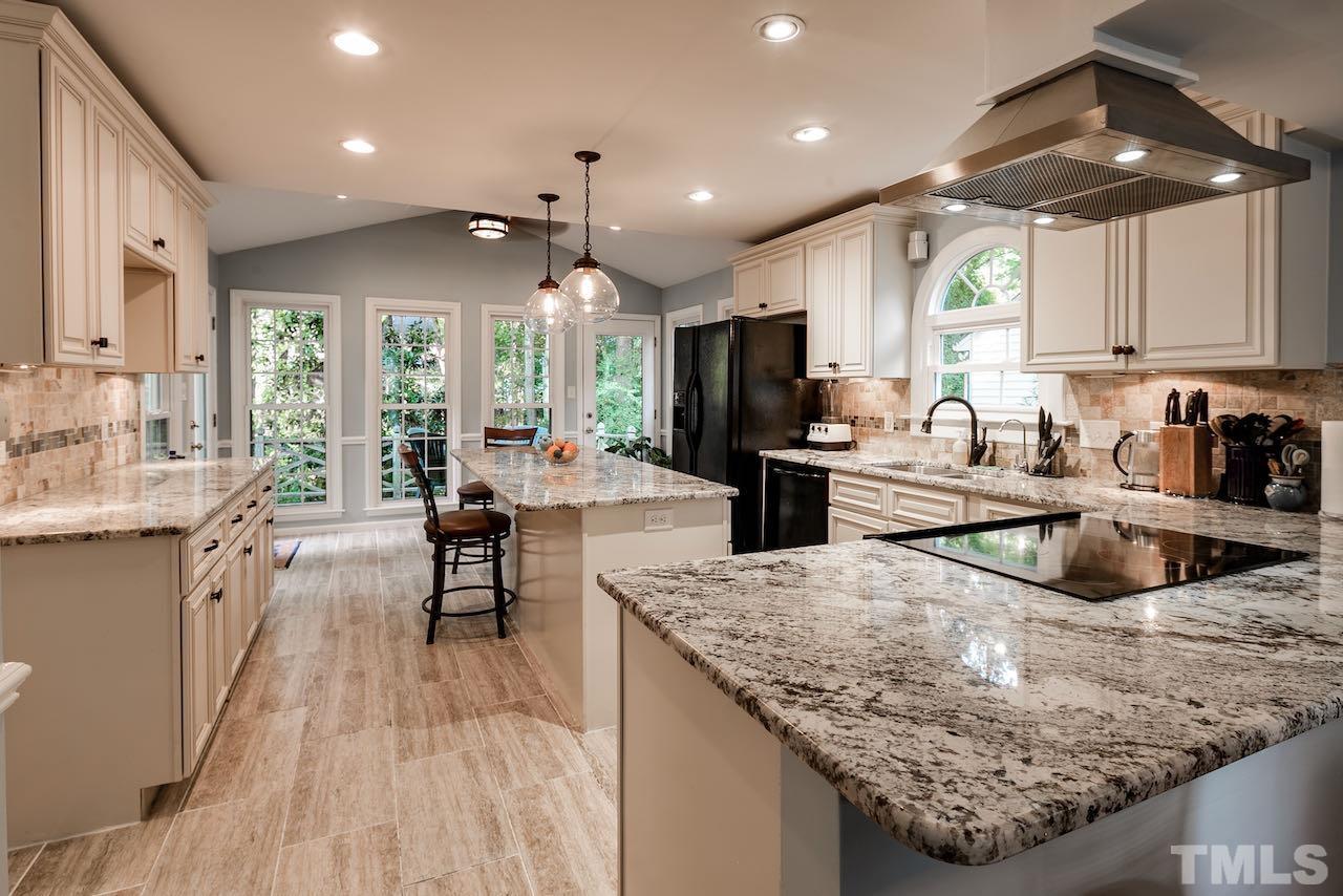 4 Cedar Hill Drive Durham, NC 27713 - Photo 2 of 49 a kitchen with sink stove and cabinets