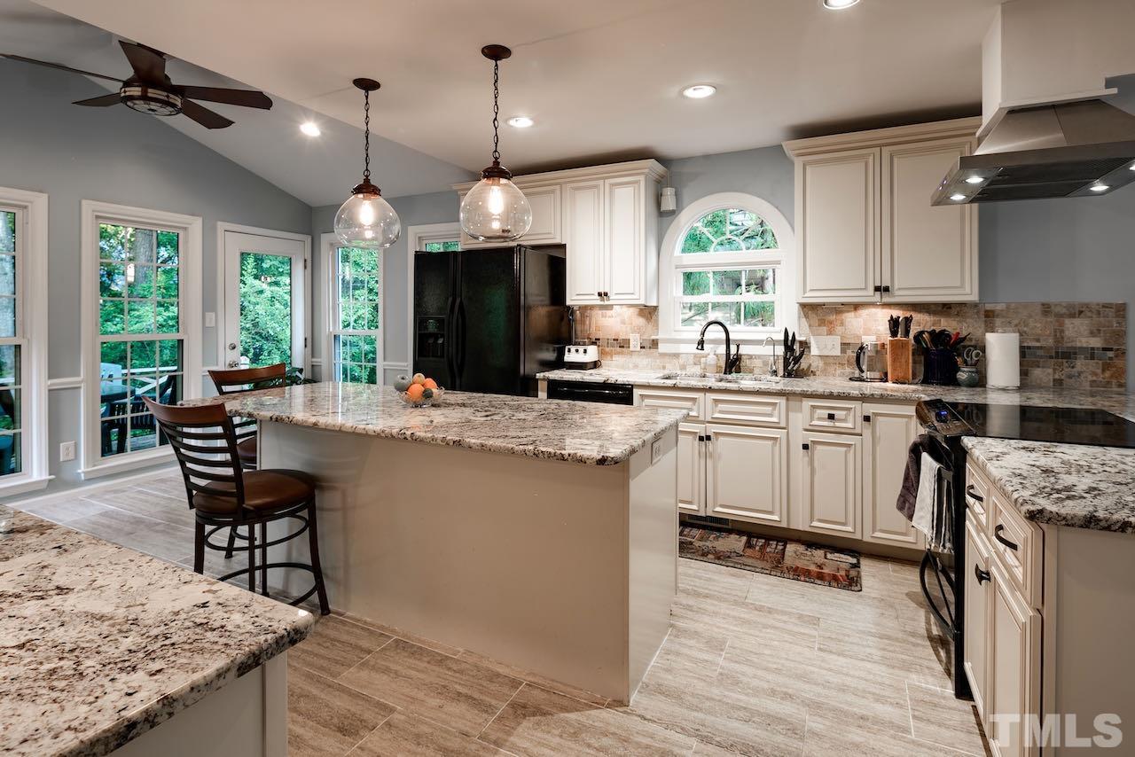 4 Cedar Hill Drive Durham, NC 27713 - Photo 4 of 49 a kitchen with a sink cabinets and window