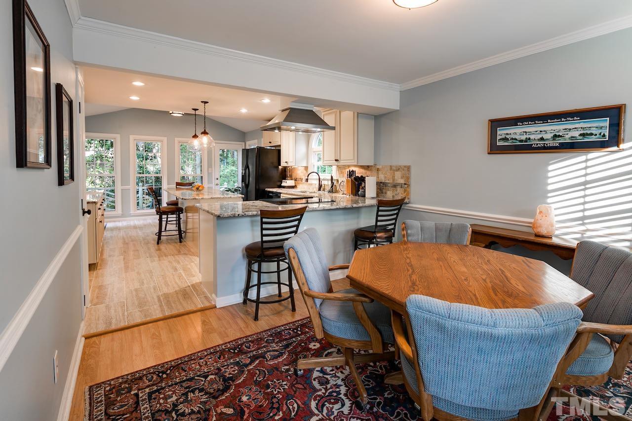 4 Cedar Hill Drive Durham, NC 27713 - Photo 8 of 49 a dining room with furniture and wooden floor
