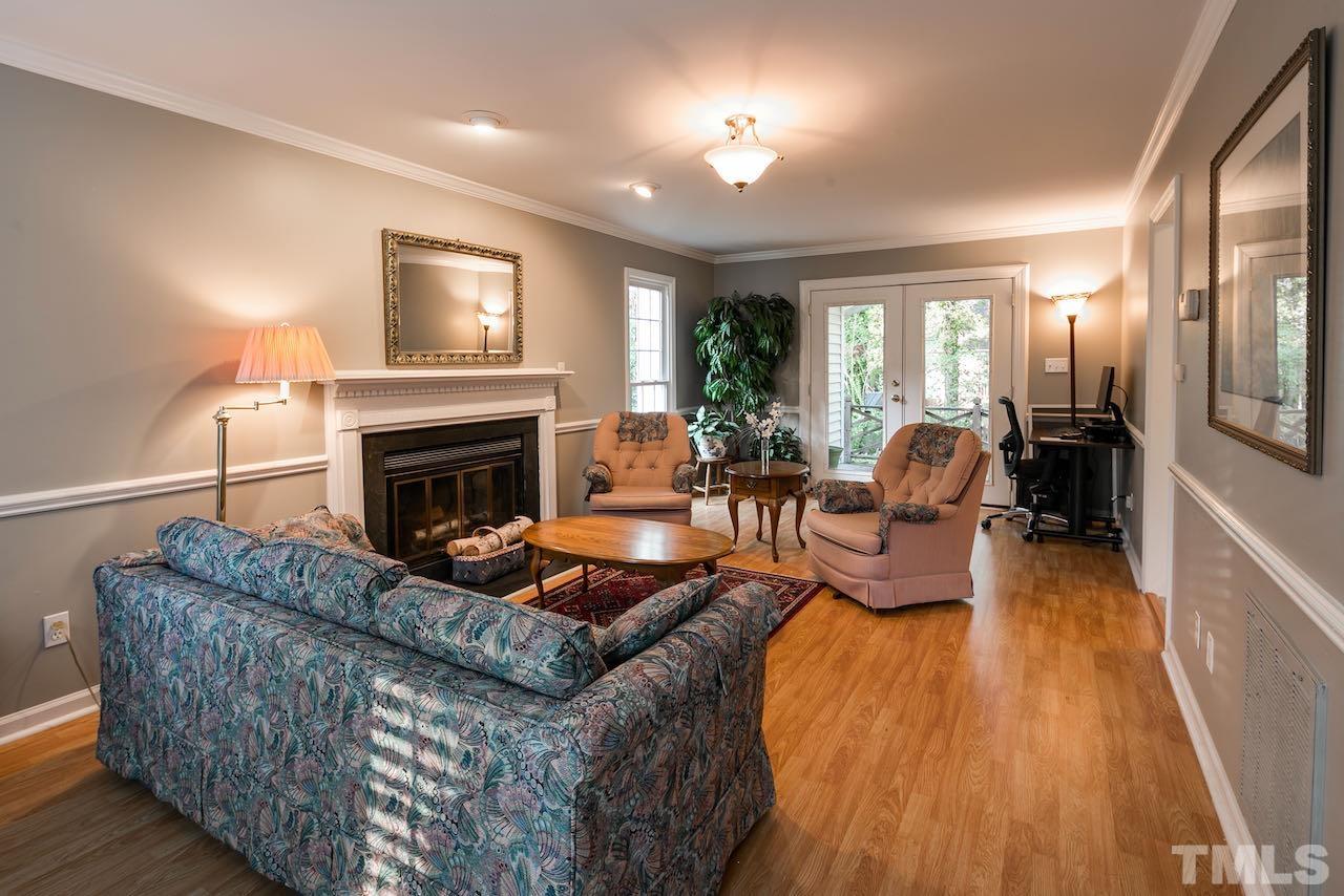 4 Cedar Hill Drive Durham, NC 27713 - Photo 9 of 49 a living room with furniture and a fireplace