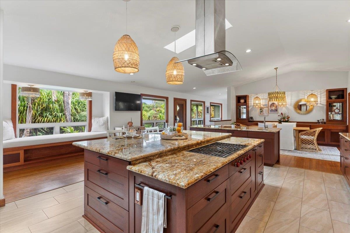 60 Koolau Road Haiku, HI 96708 - Photo 12 of 47 a kitchen with stainless steel appliances granite countertop a sink and a stove