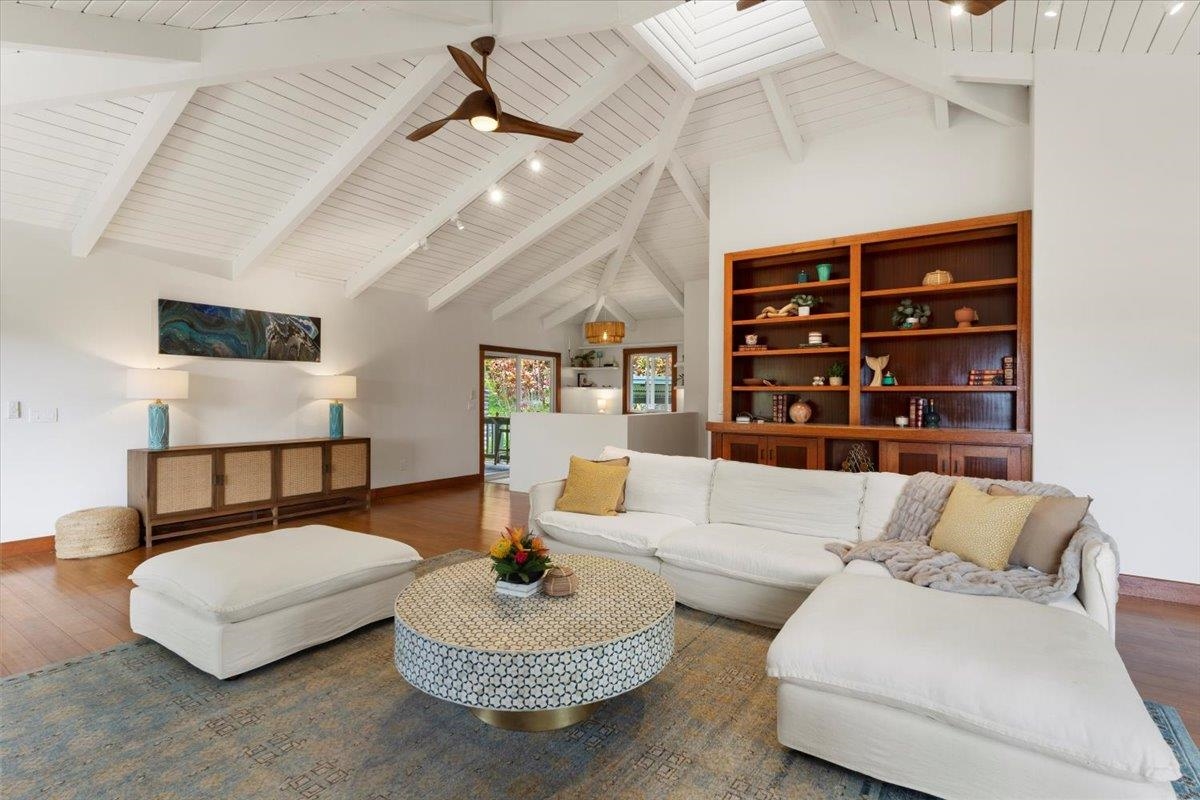 60 Koolau Road Haiku, HI 96708 - Photo 16 of 47 a living room with furniture and a book shelf
