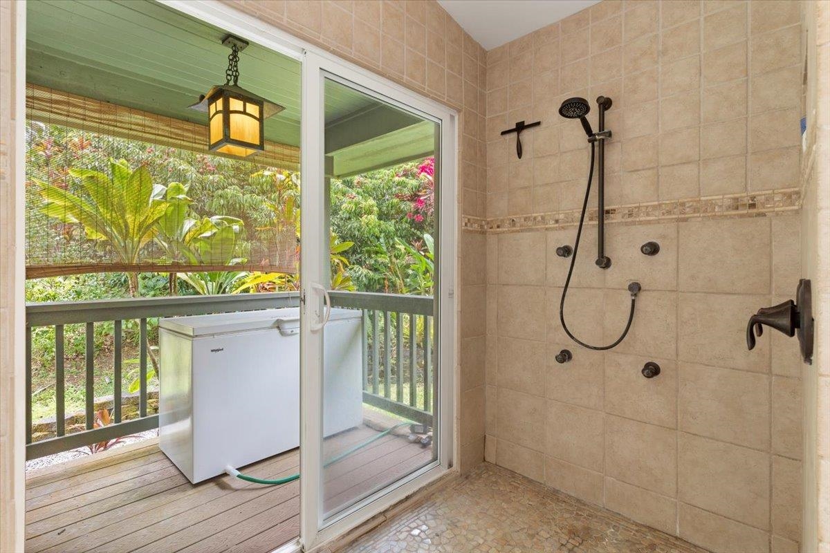 60 Koolau Road Haiku, HI 96708 - Photo 24 of 47 a bathroom with a glass shower door and a window