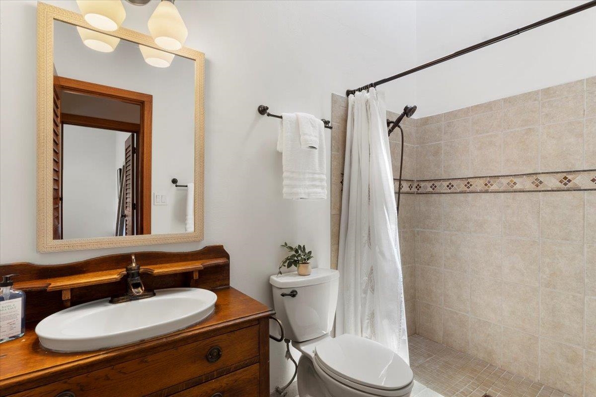 60 Koolau Road Haiku, HI 96708 - Photo 26 of 47 a bathroom with a sink toilet and shower