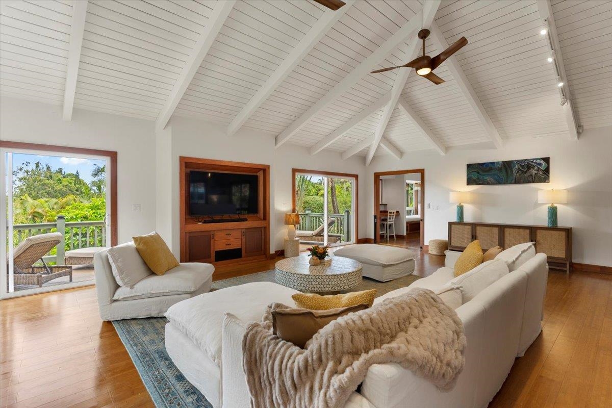 60 Koolau Road Haiku, HI 96708 - Photo 4 of 47 a living room with furniture a flat screen tv and a large window