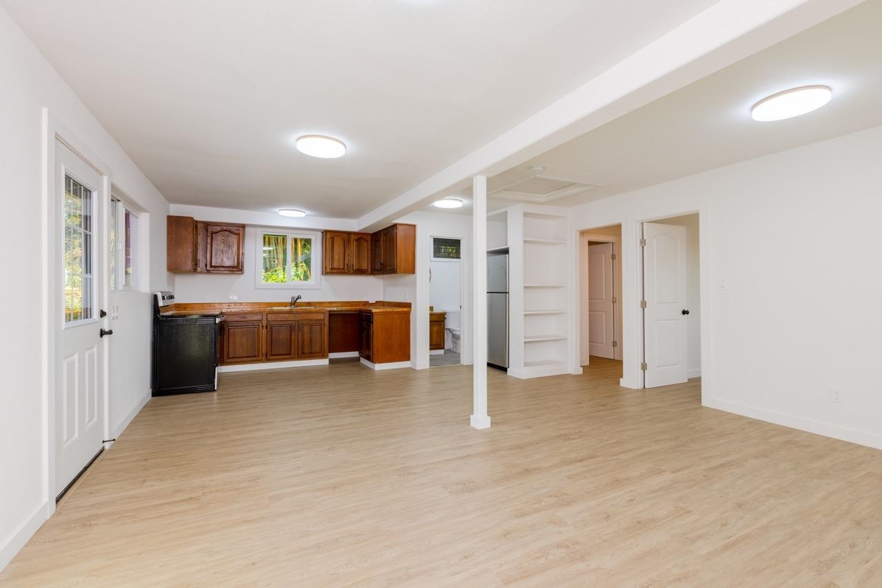 60 Koolau Road Haiku, HI 96708 - Photo 41 of 47 a view of a big room with a kitchen and fireplace