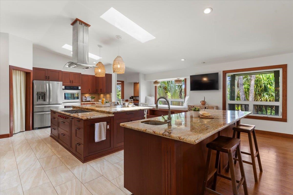 60 Koolau Road Haiku, HI 96708 - Photo 7 of 47 a kitchen with stainless steel appliances granite countertop a stove and a sink