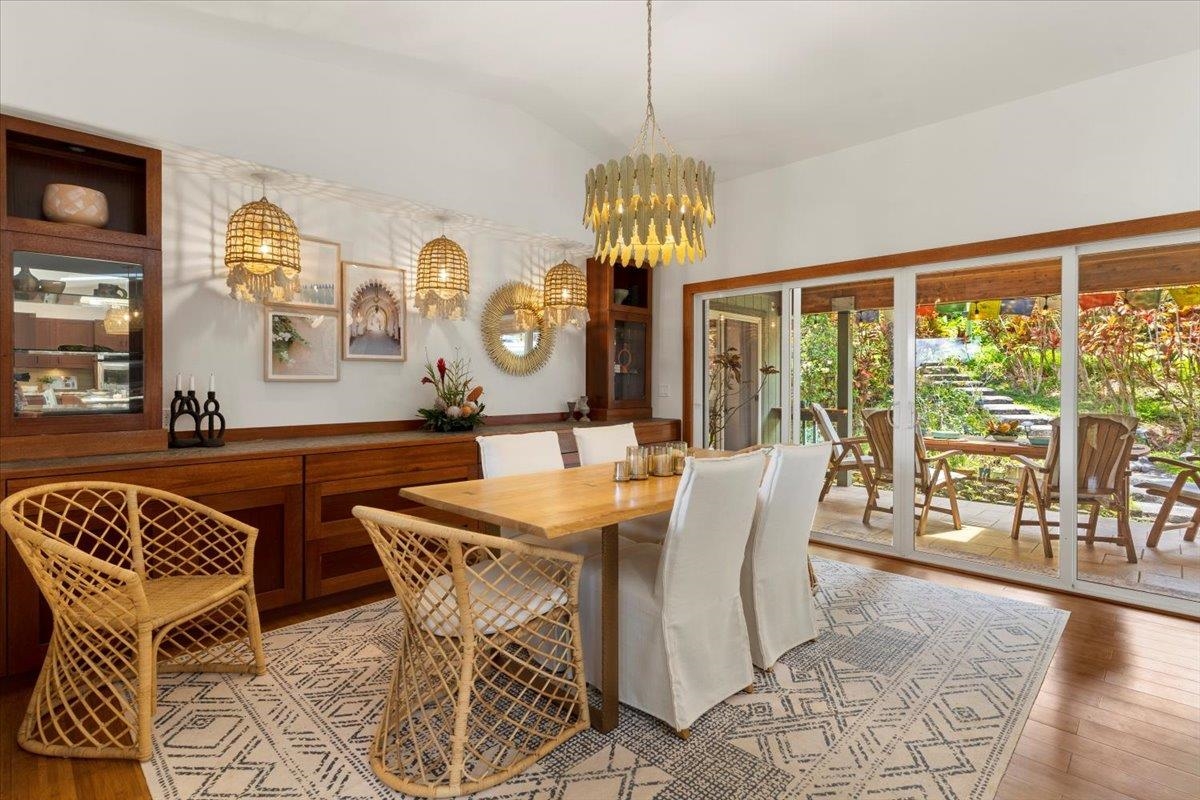 60 Koolau Road Haiku, HI 96708 - Photo 10 of 47 a view of a dining room with furniture wooden floor and chandelier