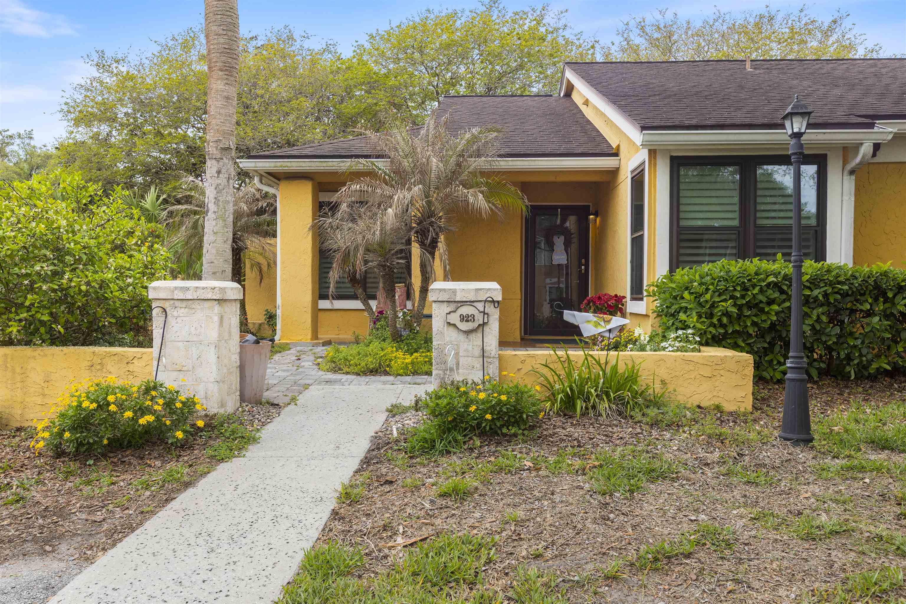 923 Seashell Lane Ponte Vedra Beach, FL 32082 - Photo 1 of 60 a front view of a house with garden