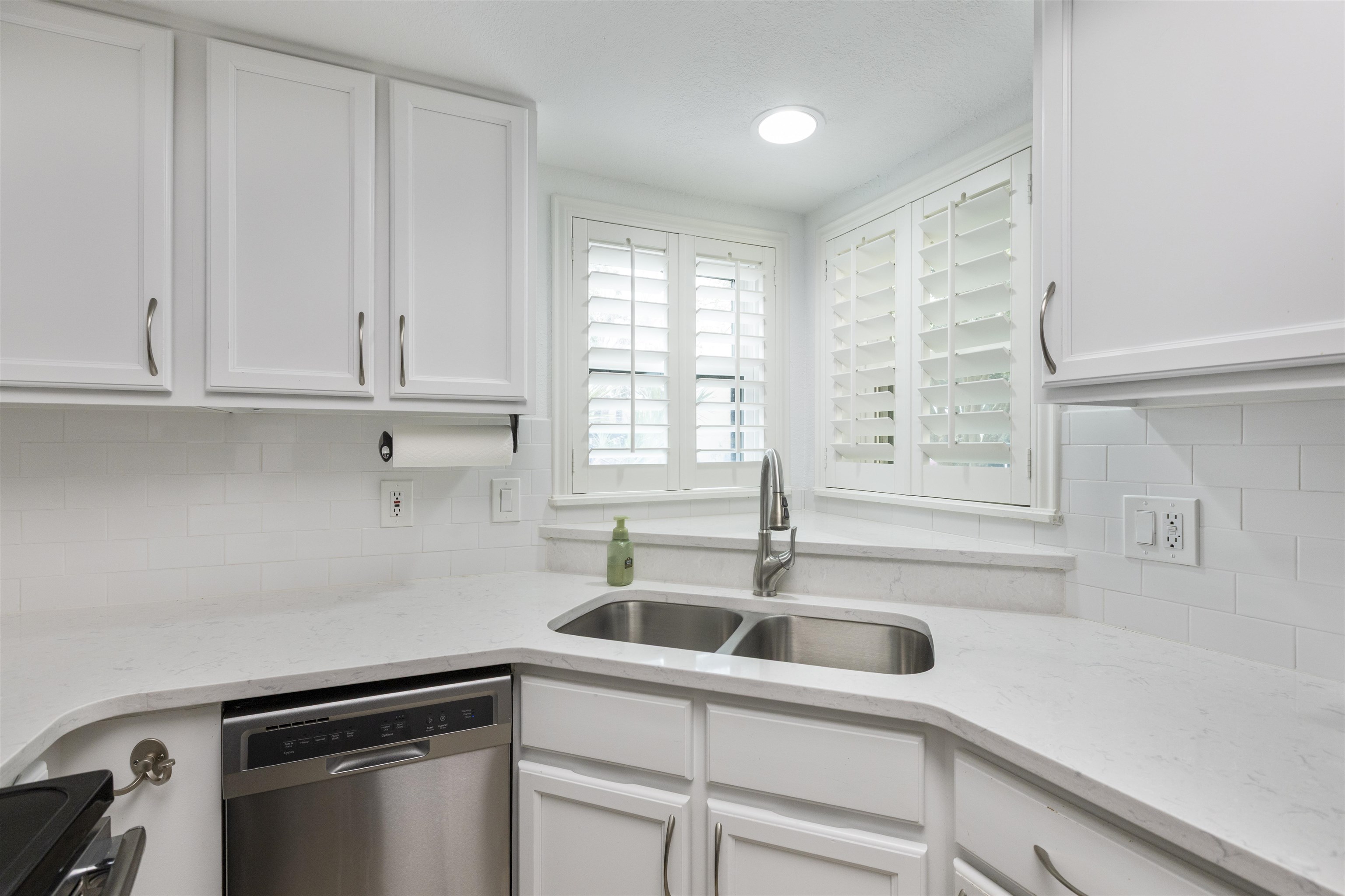 923 Seashell Lane Ponte Vedra Beach, FL 32082 - Photo 18 of 60 a kitchen with a sink cabinets and window