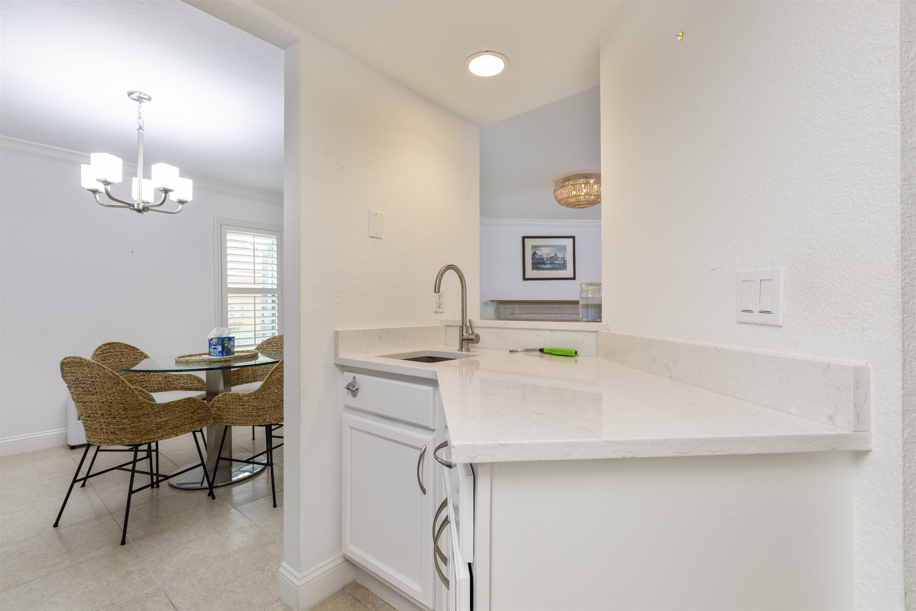 923 Seashell Lane Ponte Vedra Beach, FL 32082 - Photo 20 of 60 a kitchen that has a sink and a stove in it