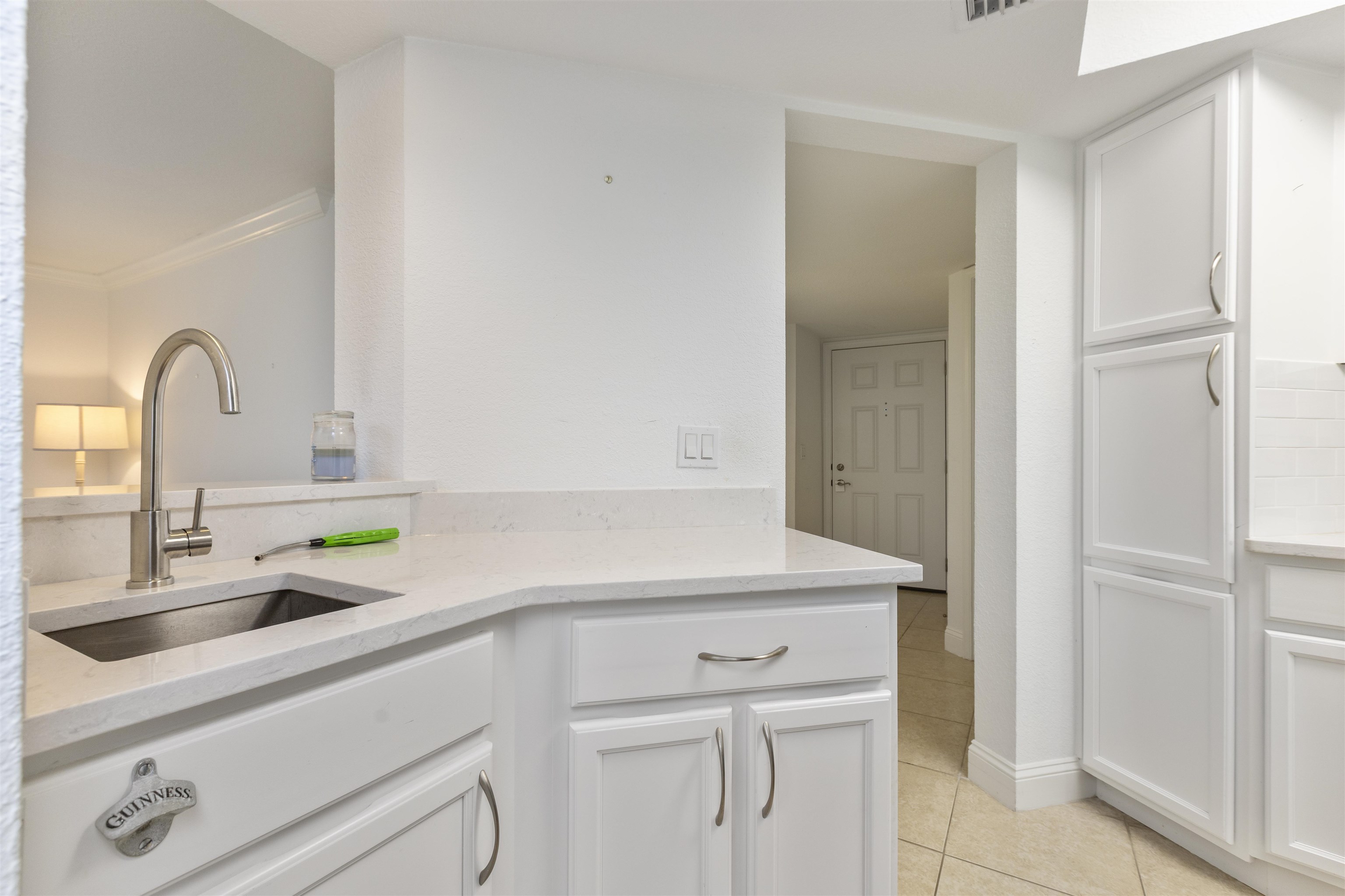 923 Seashell Lane Ponte Vedra Beach, FL 32082 - Photo 21 of 60 a kitchen with a sink and a refrigerator