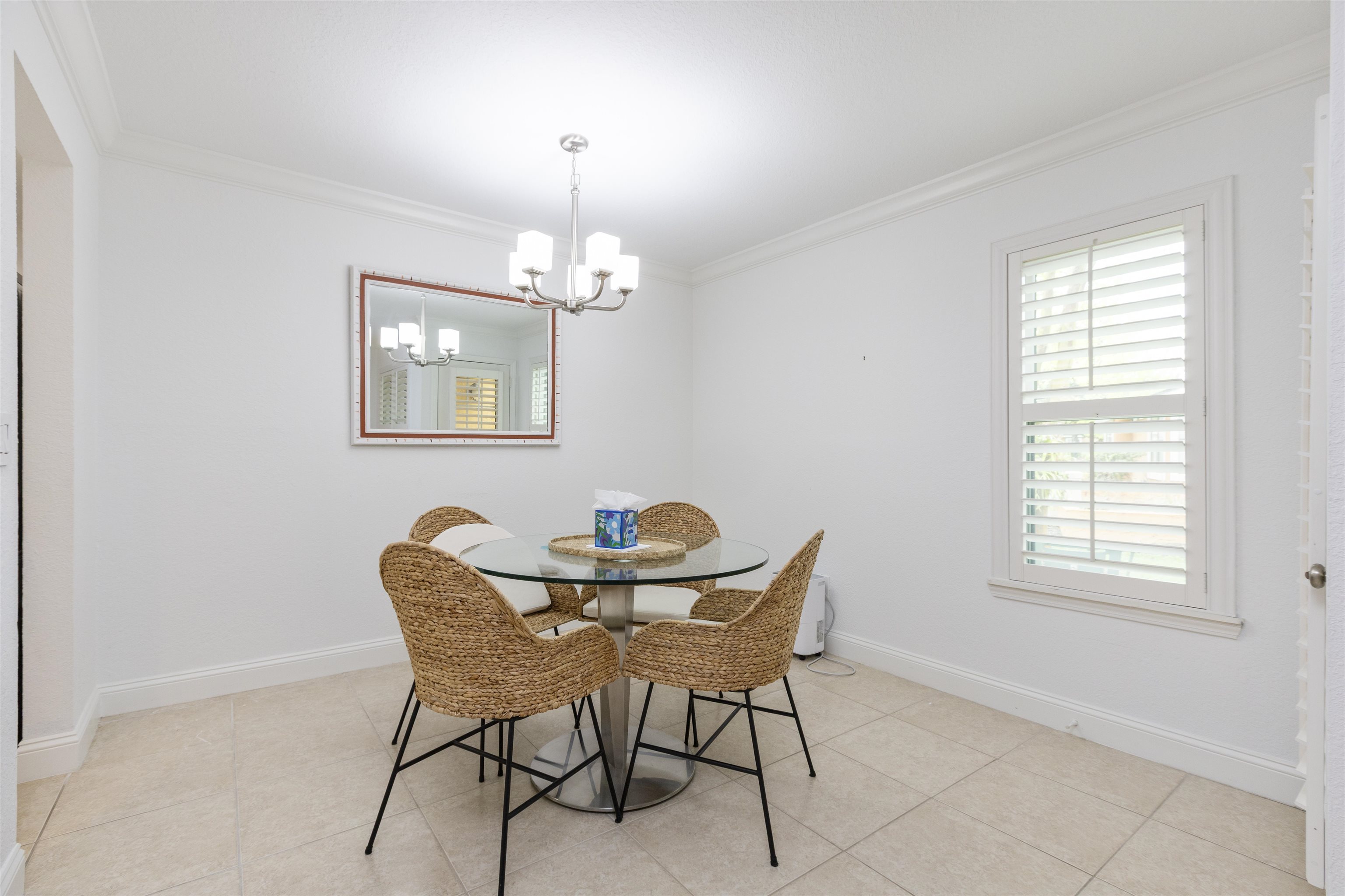 923 Seashell Lane Ponte Vedra Beach, FL 32082 - Photo 22 of 60 a view of a dining room with furniture and chandelier