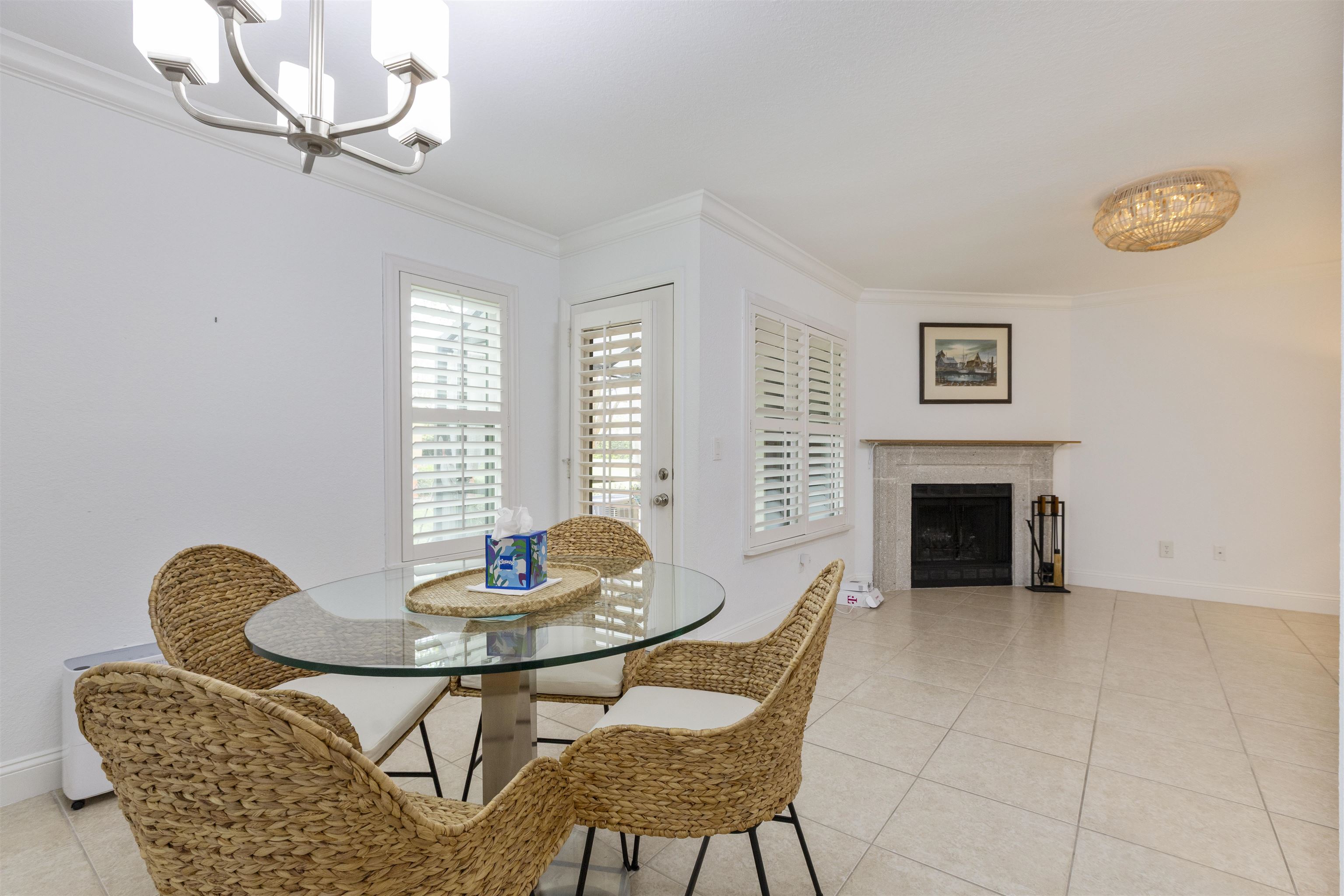 923 Seashell Lane Ponte Vedra Beach, FL 32082 - Photo 23 of 60 a dining room with furniture a fireplace and a chandelier