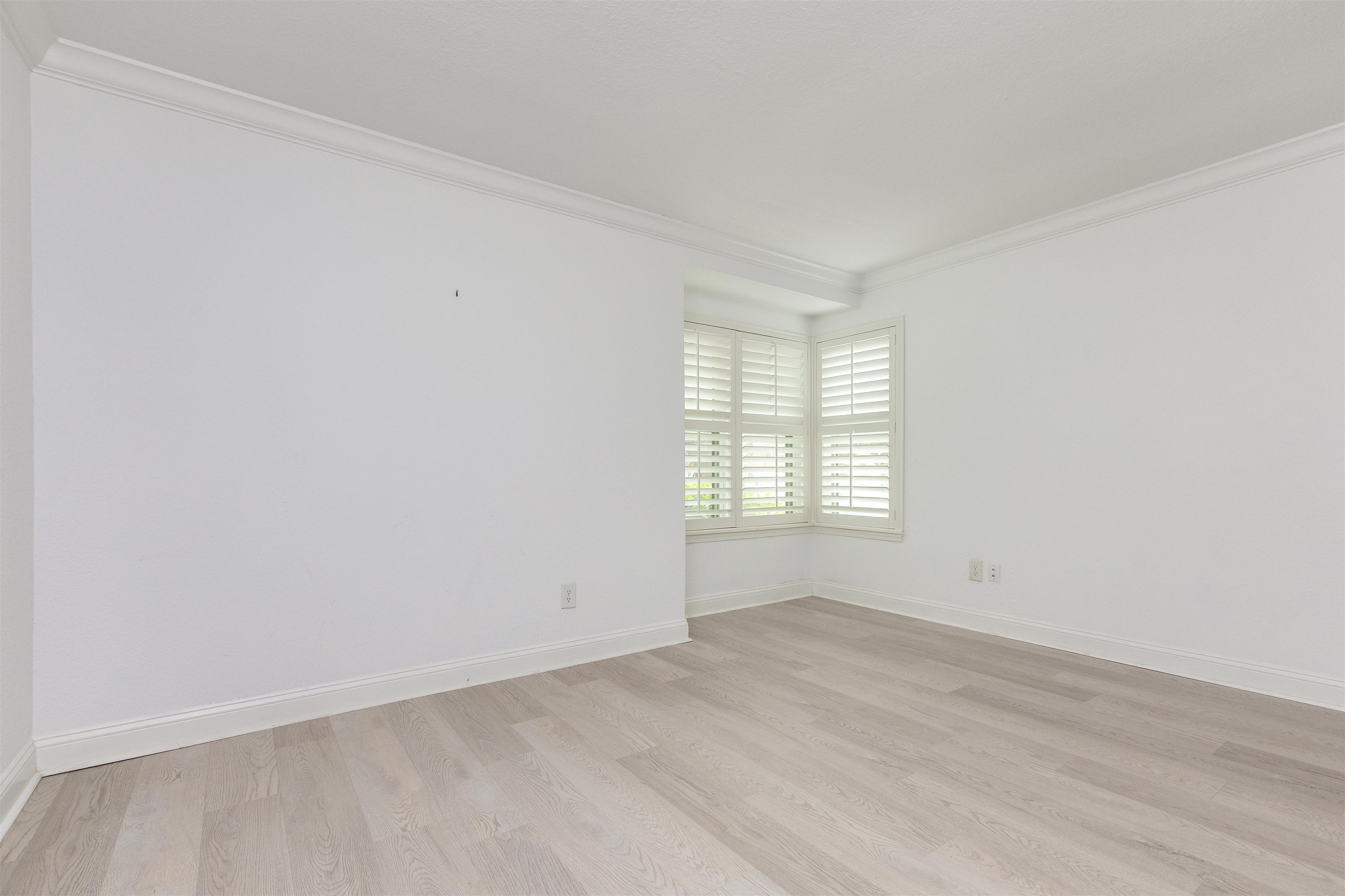 923 Seashell Lane Ponte Vedra Beach, FL 32082 - Photo 30 of 60 a view of an empty room with wooden floor and a window