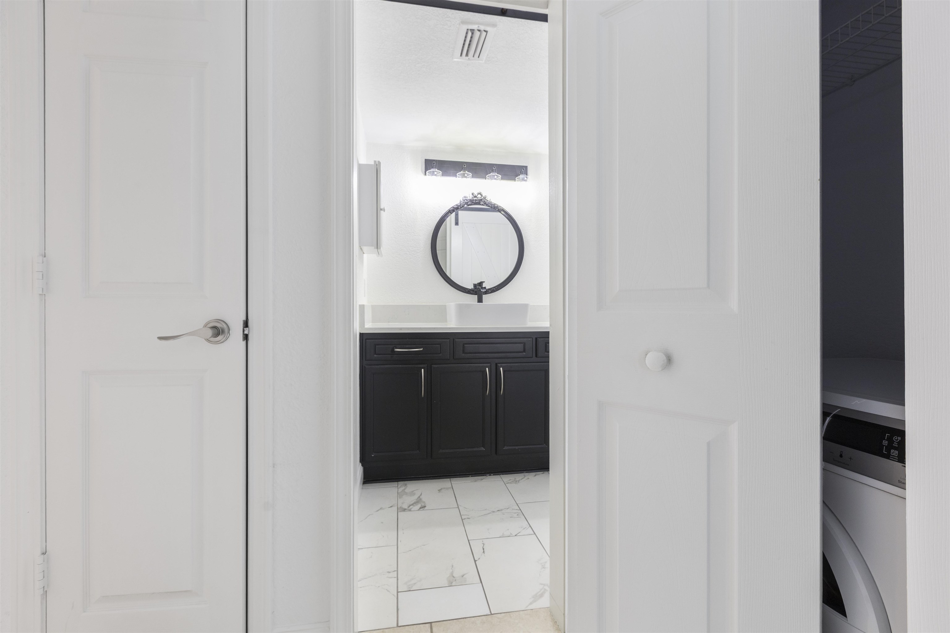 923 Seashell Lane Ponte Vedra Beach, FL 32082 - Photo 34 of 60 a bathroom with a granite countertop sink and a mirror