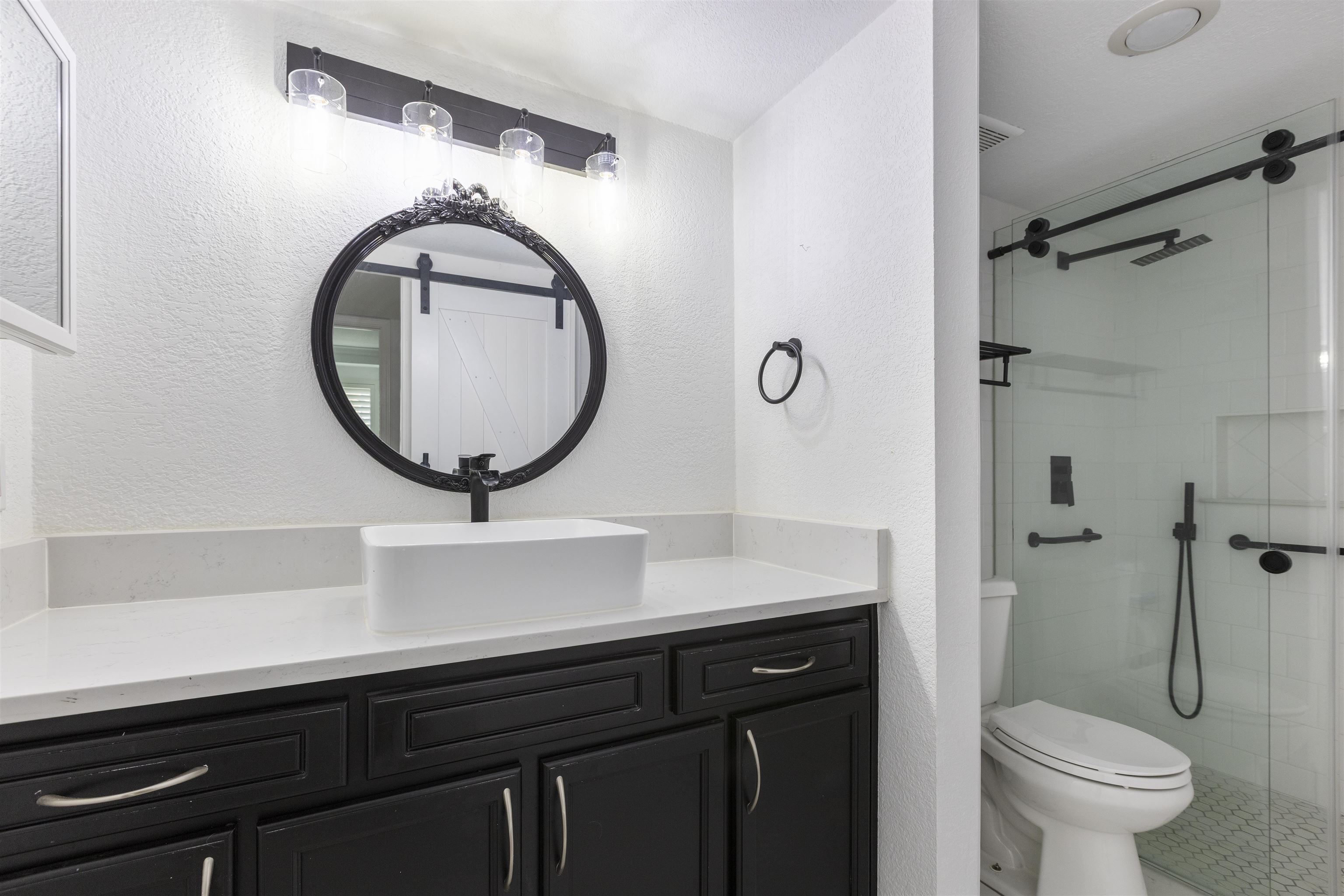 923 Seashell Lane Ponte Vedra Beach, FL 32082 - Photo 35 of 60 a bathroom with a sink a toilet and a mirror