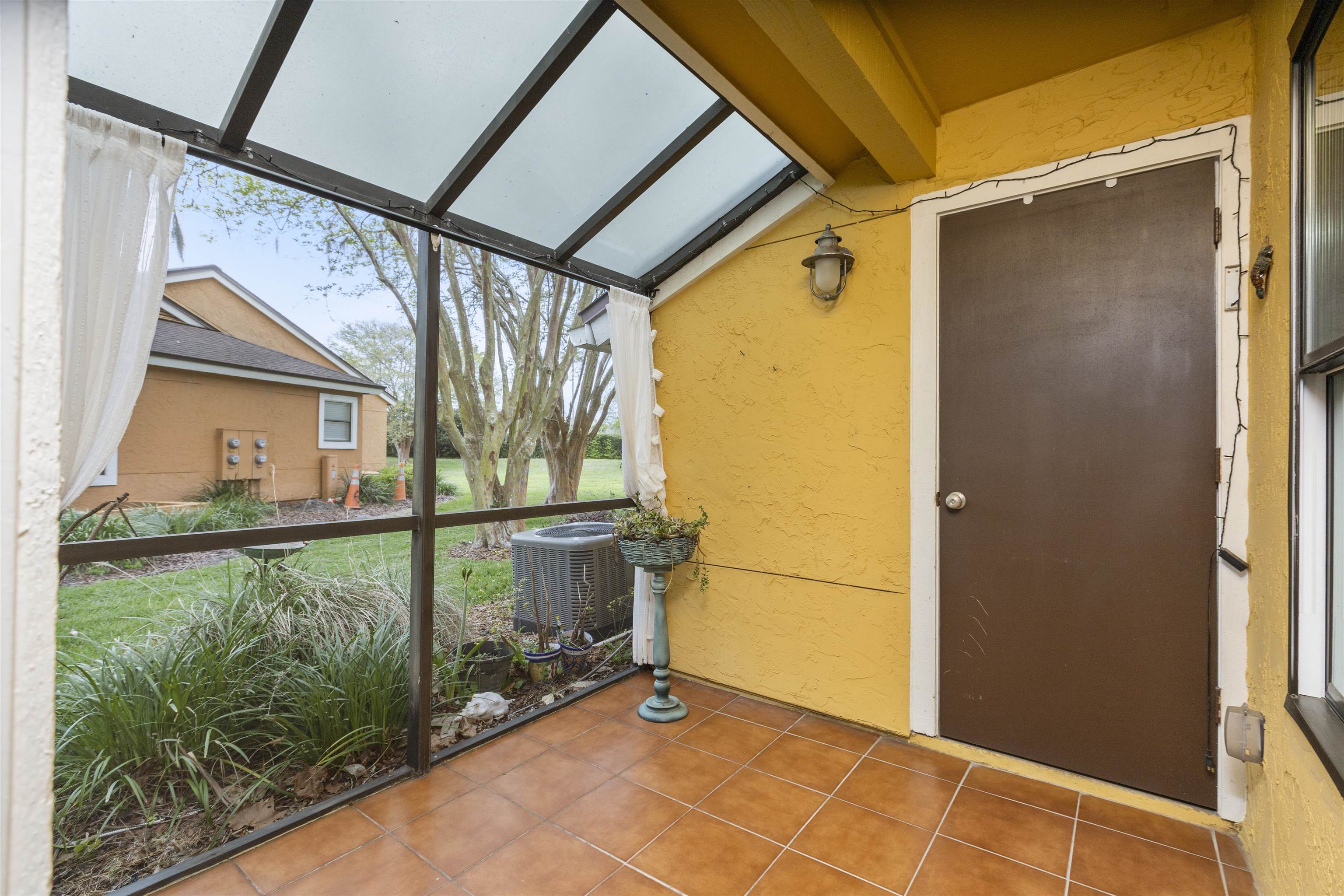 923 Seashell Lane Ponte Vedra Beach, FL 32082 - Photo 46 of 60 a view of a balcony with wooden floor and door