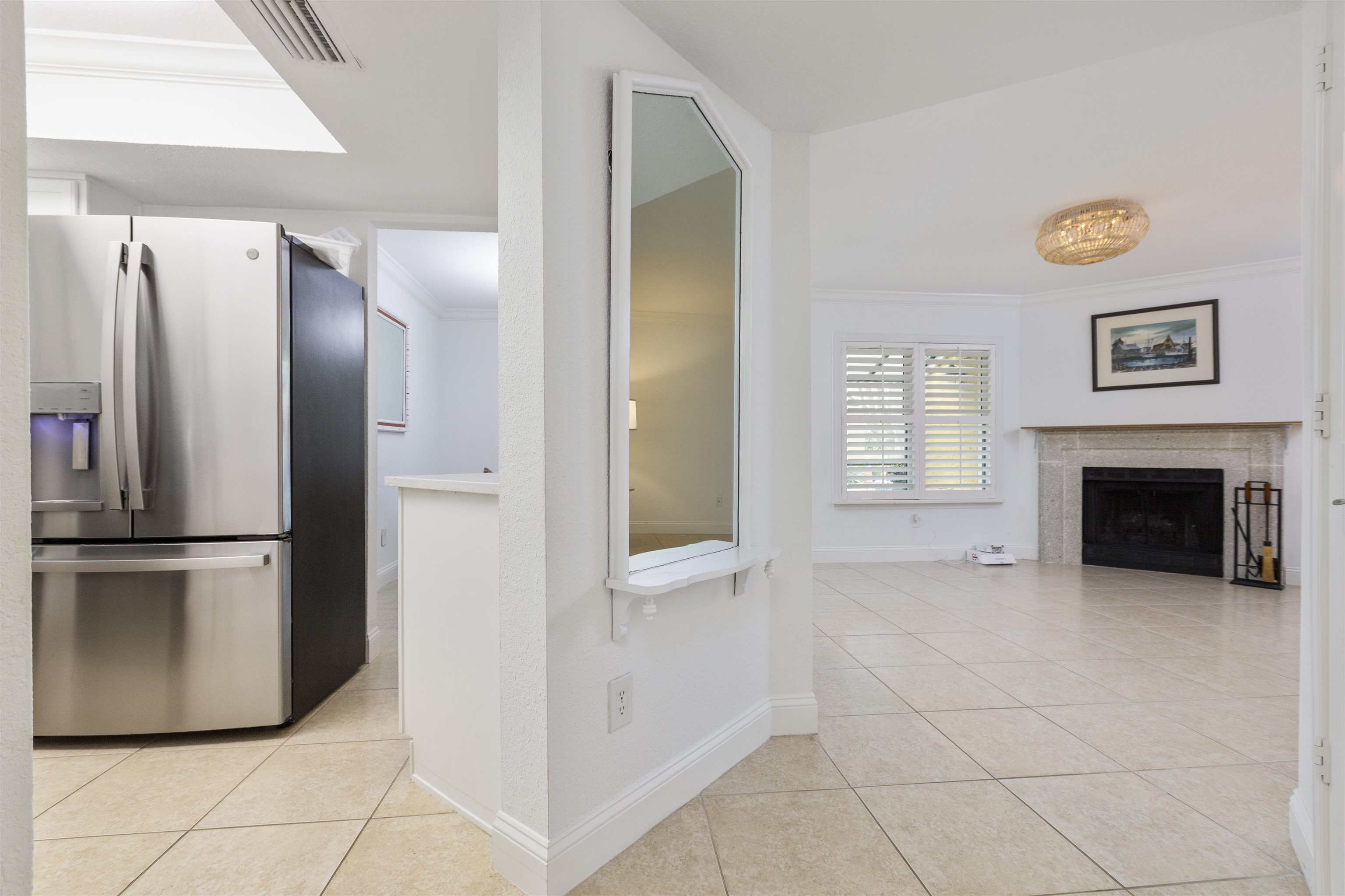 923 Seashell Lane Ponte Vedra Beach, FL 32082 - Photo 5 of 60 a view of a kitchen with a refrigerator and a fireplace