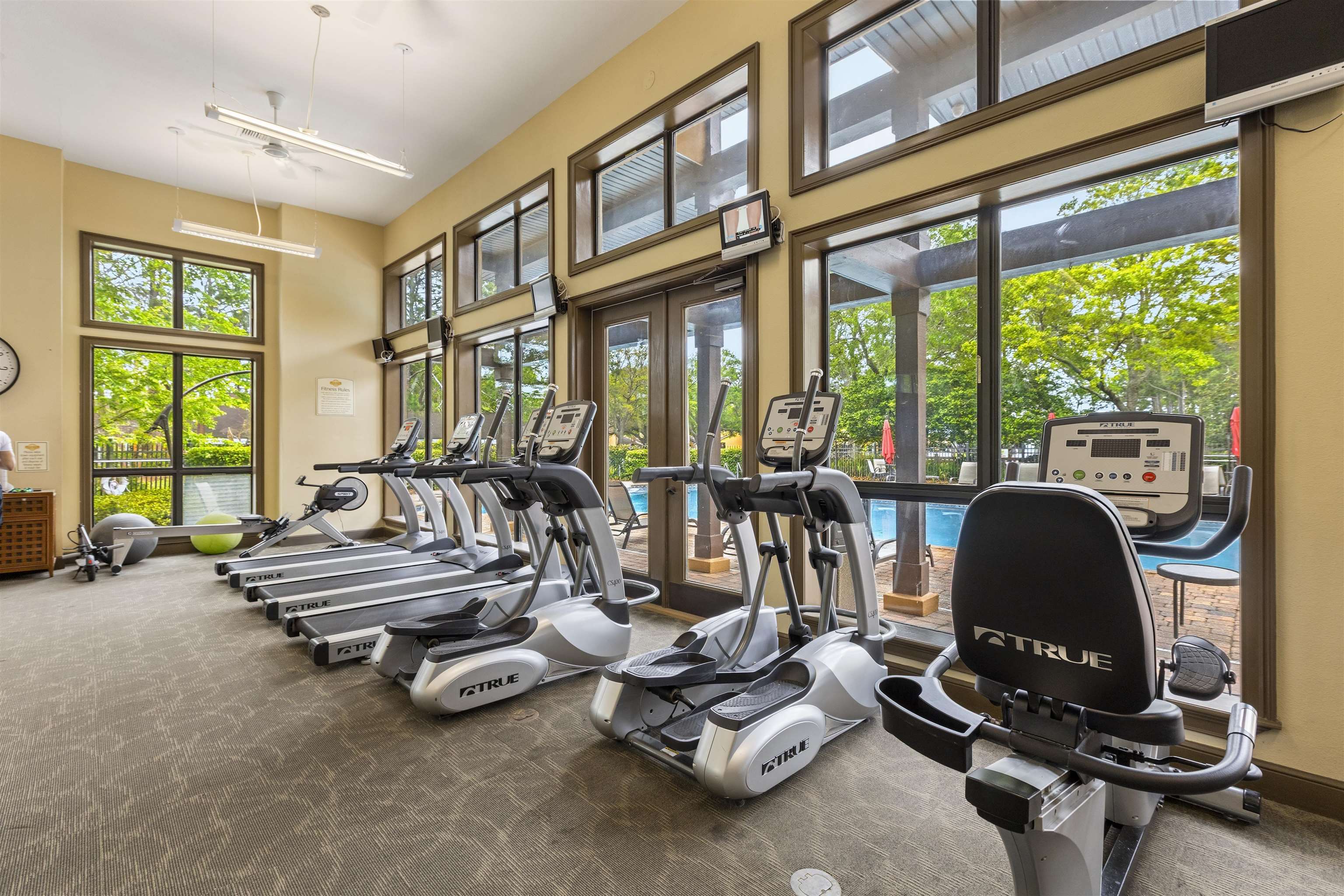 923 Seashell Lane Ponte Vedra Beach, FL 32082 - Photo 58 of 60 a room with gym equipment and large windows
