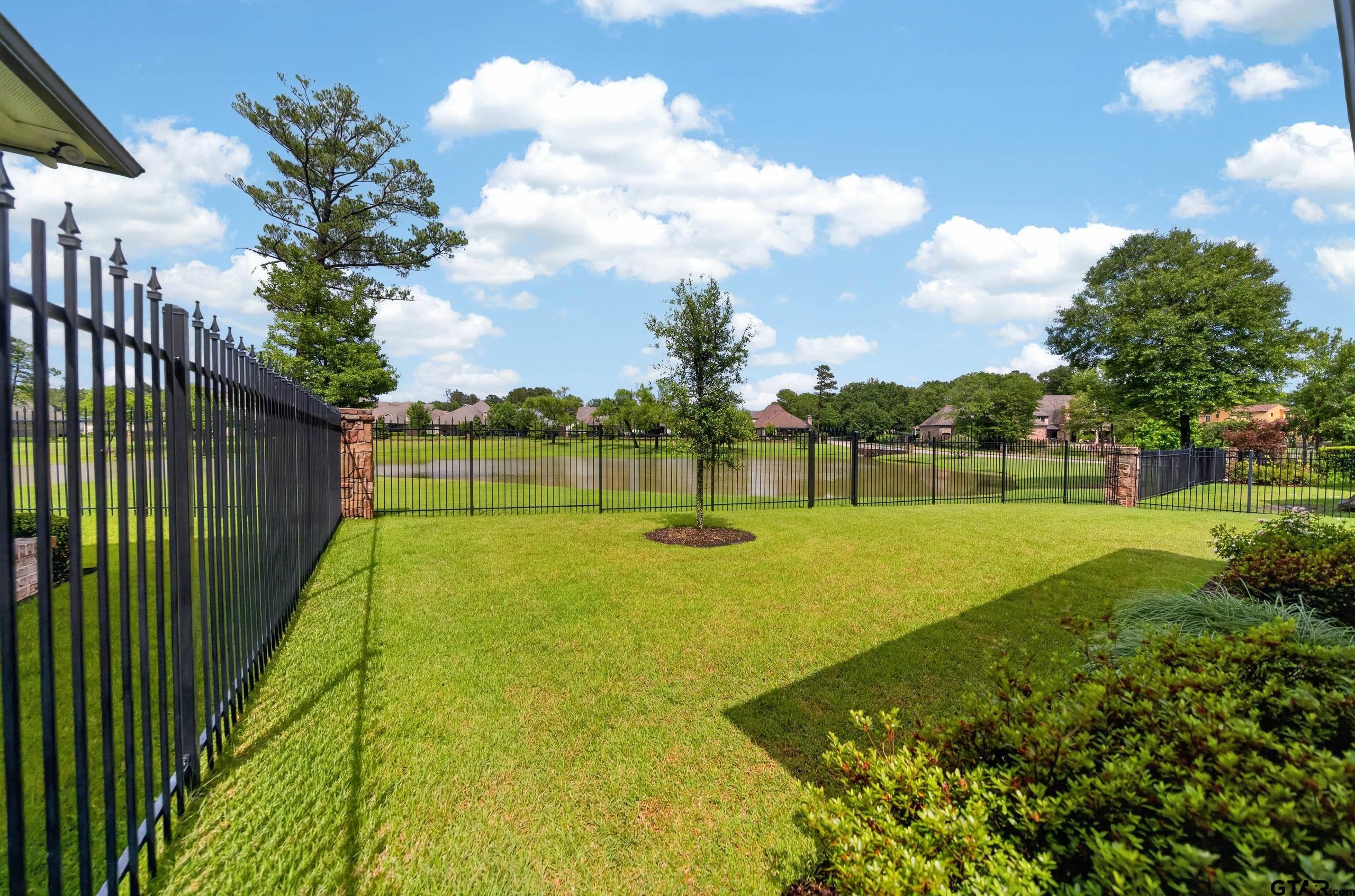 7517 Cross Gate Way Tyler, TX 75703 - Photo 25 of 47 a view of a golf course with a lake view