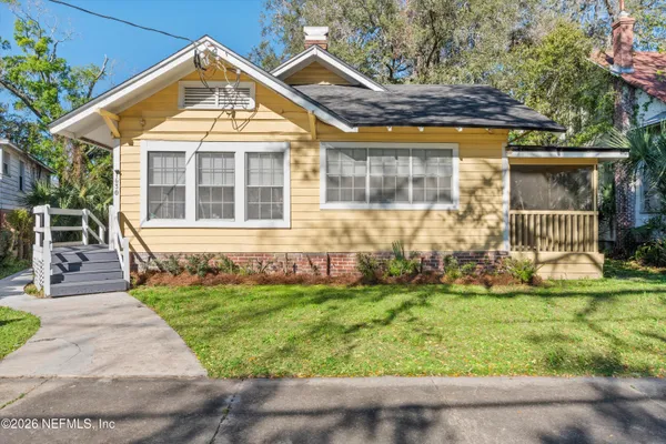 front view of a house with a yard