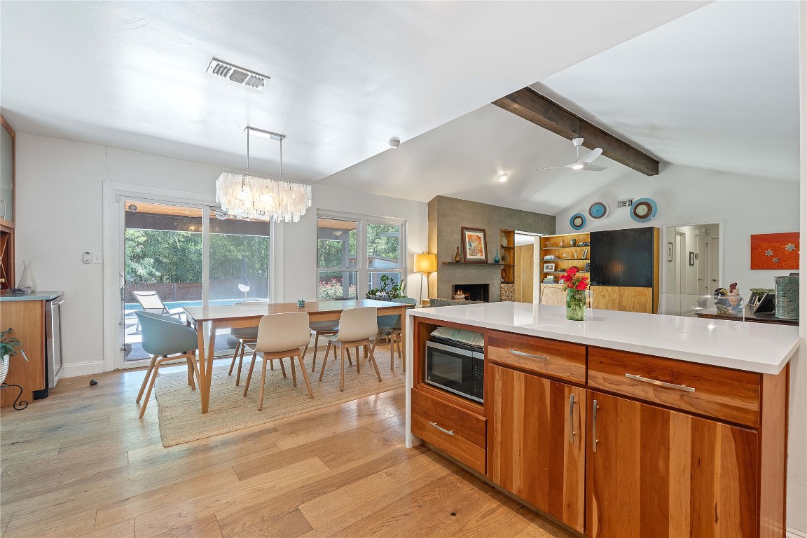 1407 Spring Garden Road Austin, TX 78746 - Photo 13 of 28 a dining hall with stainless steel appliances granite countertop a stove and a view of living room