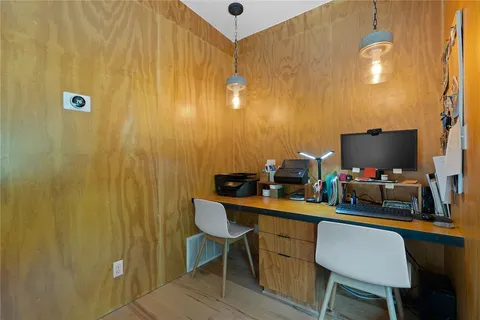 a view of a workspace with furniture