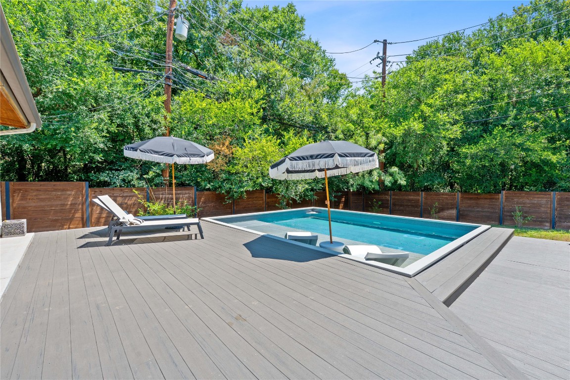 1407 Spring Garden Road Austin, TX 78746 - Photo 21 of 28 an outdoor space with pool and furniture