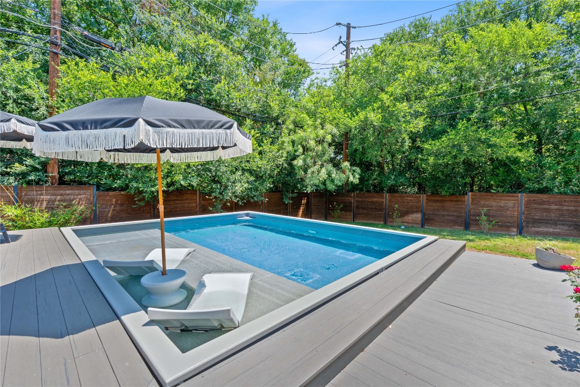 1407 Spring Garden Road Austin, TX 78746 - Photo 25 of 28 a view of a backyard with a patio